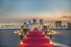 Rooftop dining setup with skyline views at JW Marriott Marquis City Center Doha