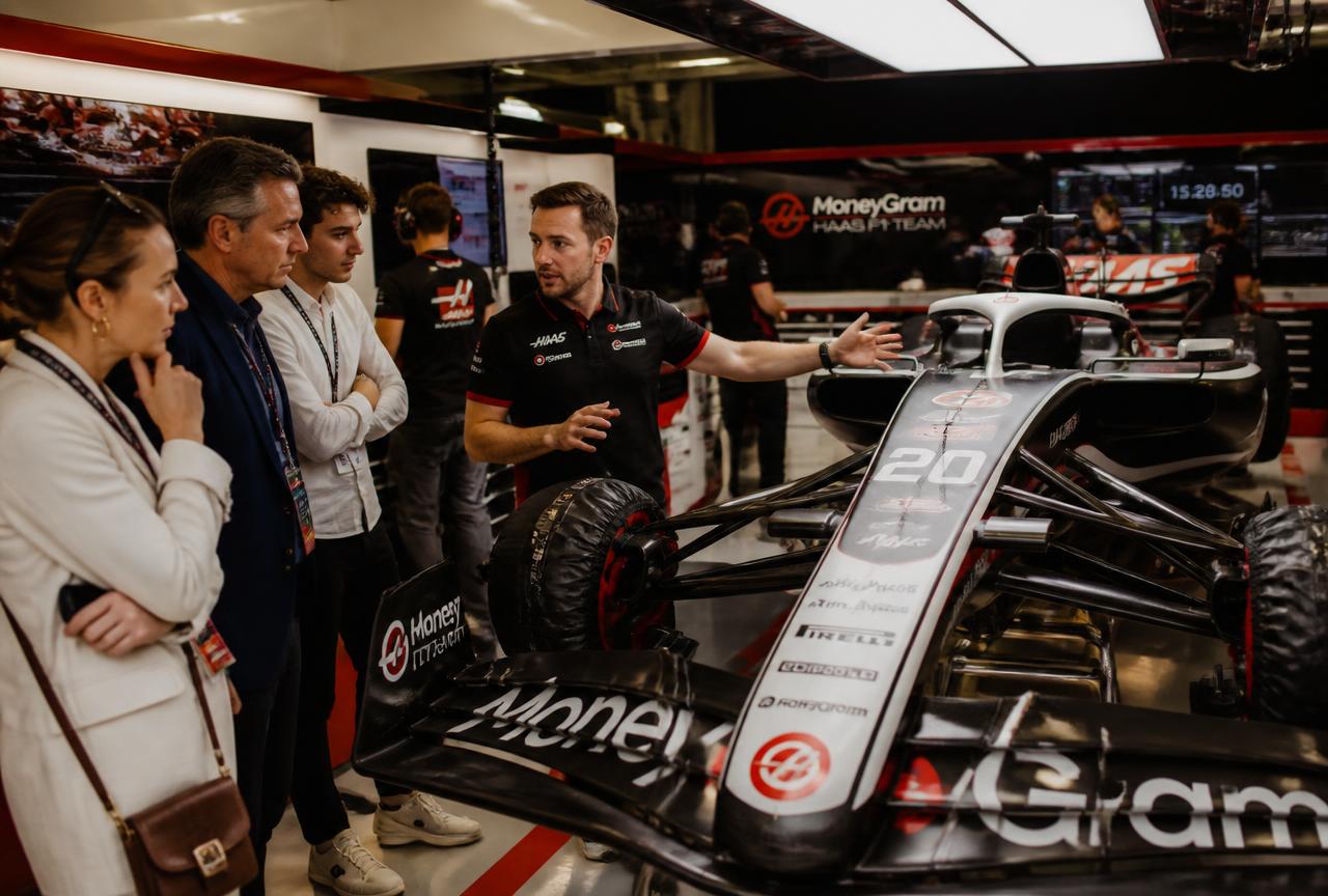 Expert host guiding guests through the TGR Haas F1 team garage