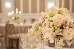 Fine dining table setting with fresh floral centrepiece