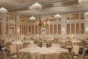 Grand chandelier ballroom set for a gala dinner